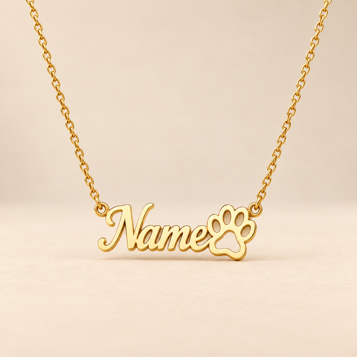 Custom paw print name necklace on warm beige background