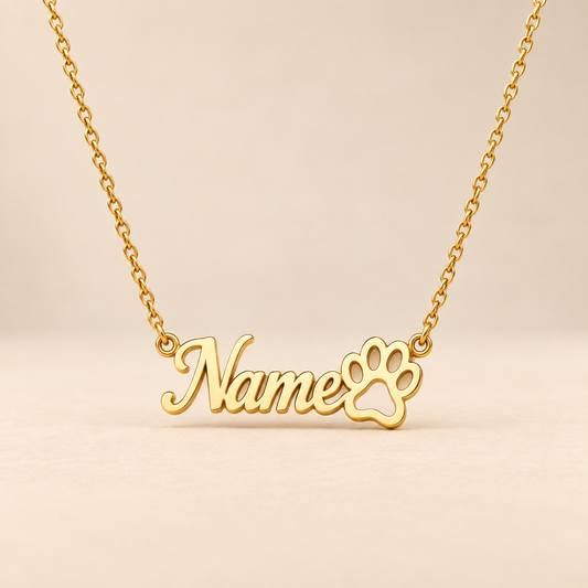 Custom paw print name necklace on warm beige background